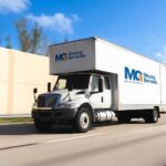 mg moving services truck on the road