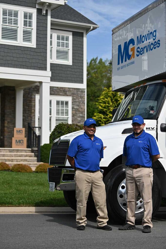 movers by truck in front of house