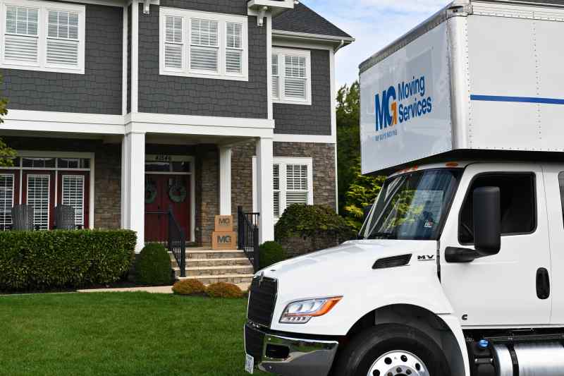 moving truck in front of house